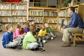 Parent reading during story time Parent reading during story time