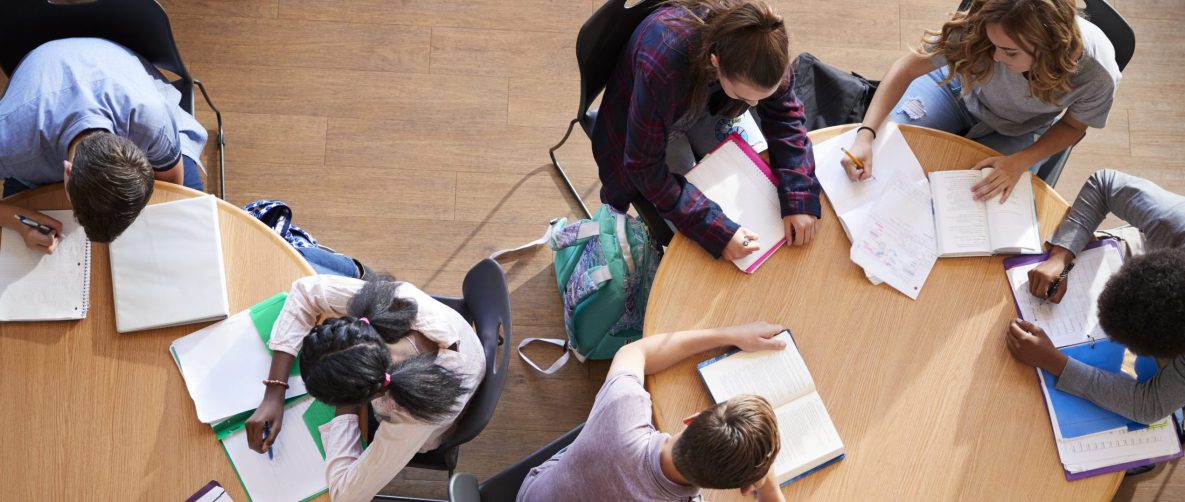 a group of high school students studying