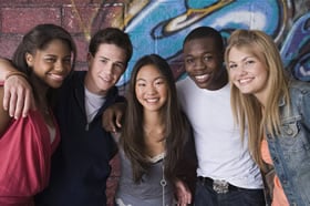 Image of 5 students in front of the wall