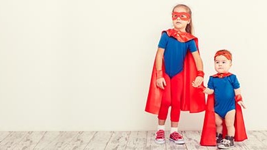 vitamin and mineral superheroes Older sister and younger brother dressed as superheroes.