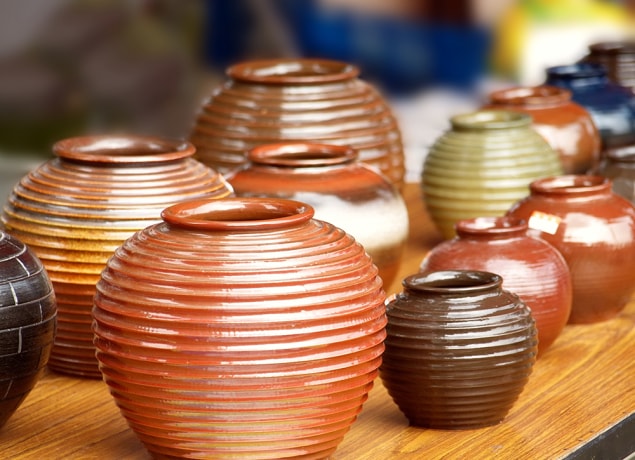 Ceramic pots Several ceramic pots sitting on a table.