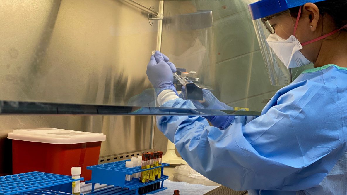 Class of 2020 LLS fellow Christine Lee processes samples during a deployment for a University of Wisconsin COVID-19 antigen study.