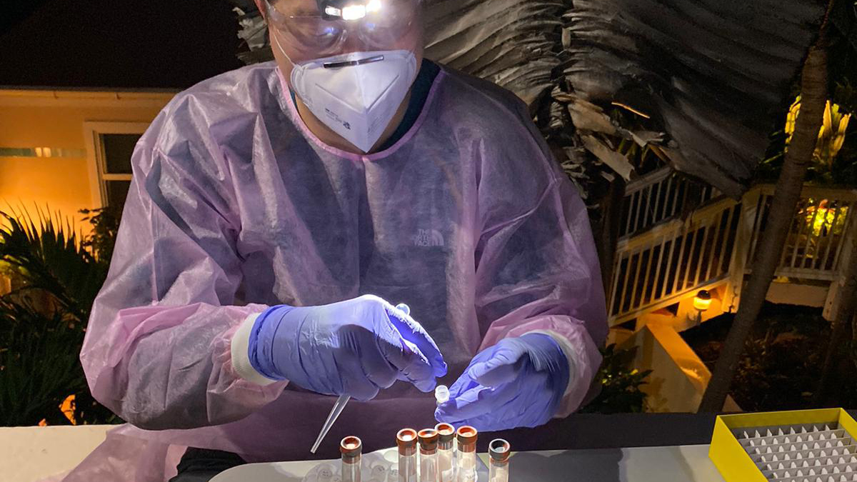 LLS fellow works at night in the U.S. Virgin Islands on an Epi-Aid response.