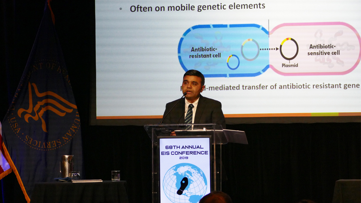 Man at podium presenting at 69ths annual EIS conference