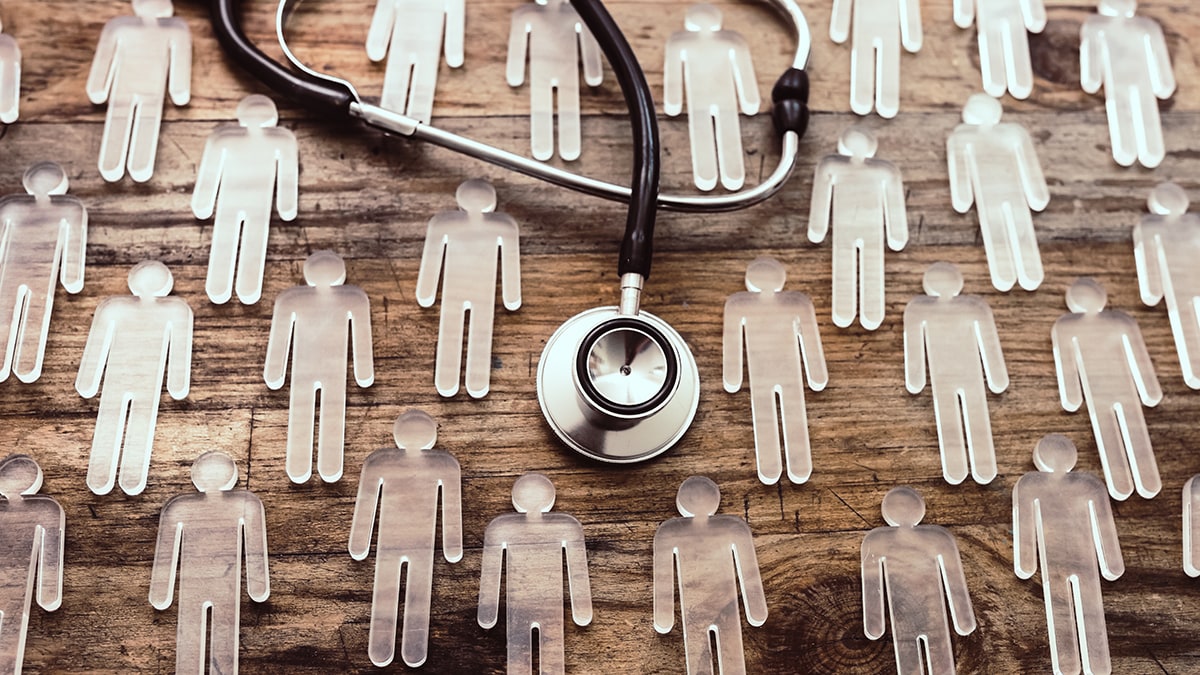 Epidemiology Transparent figurines and stethoscope on wood background