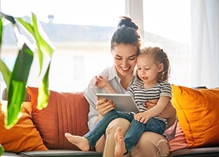 Mother reading to daughter