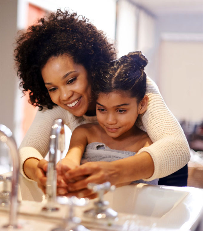 p1119-8-holiday-tips-handwashing mother helping daughter wash her hands