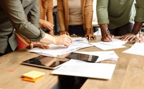 people working at conference table