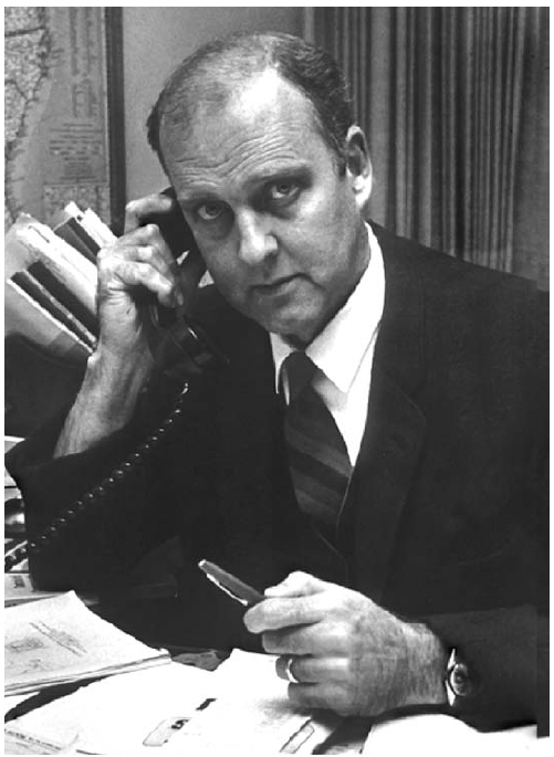 The figure is a photo of Michael B. Gregg, former editor of MMWR.