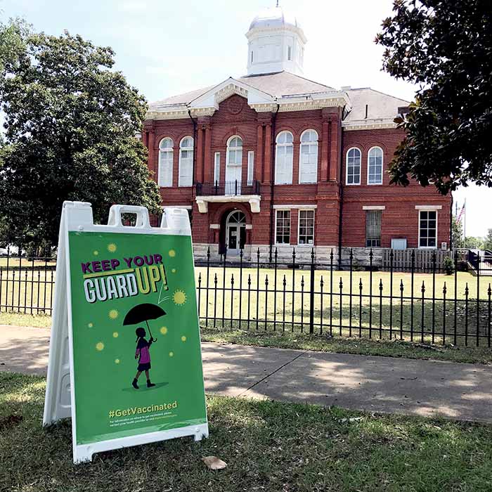 photograph of “Keep Your Guard Up” sign on sandwich board outside of courthouse in Sumpter County photograph of “Keep Your Guard Up” sign on sandwich board outside of courthouse in Sumpter County