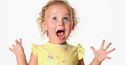 Happy Child A happy girl wearing a yellow top