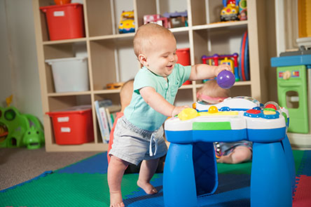 9 Months_Stands, holding on-444px A nine-month-old performing a milestone: stands %26amp; holding on