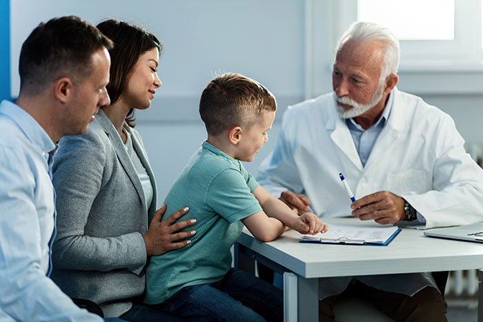 Boy with his parents at doctor's appointment Boy with his parents at doctor's appointment