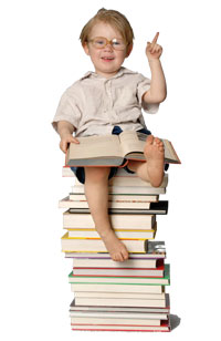 Kid-01.jpg_fea74 Boy sitting on stack of books