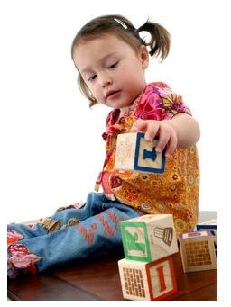 child-playing-with-blocks Little girl playing with blocks
