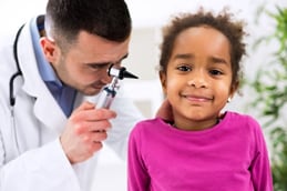 doctors-exam-girl A doctor checking a girls ear