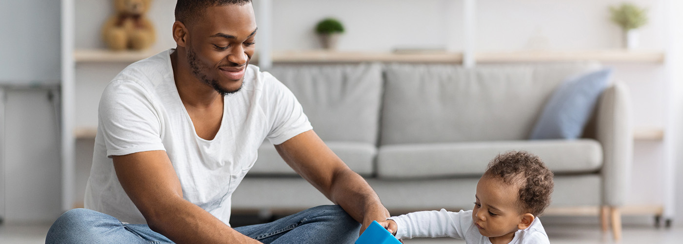 father-son Happy Young Black Father Playing With His Infant Baby Son At Home