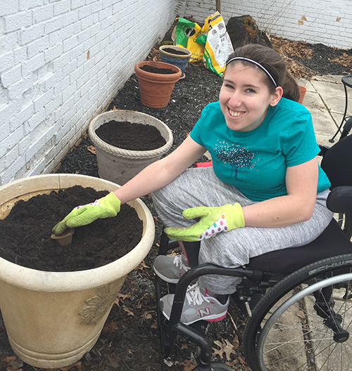 gardening-wheelchair Young woman gardening from her wheelchair
