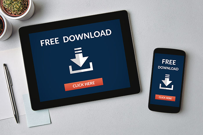 Download icon on tablet and smartphone screen Download icon on tablet and smartphone screen