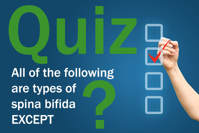 Hand with pen and check boxes Quiz: What is Spina Bifida?