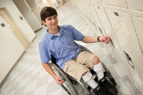 teen-boy-at-locker.jpg A teen boy with spina bifida at his school locker