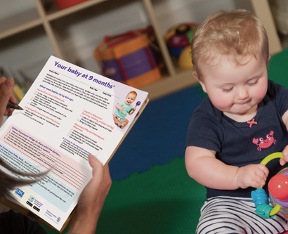 Mom using checklist with baby 9 mo_F_CDC-4268 Mom using checklist with baby 9 mo