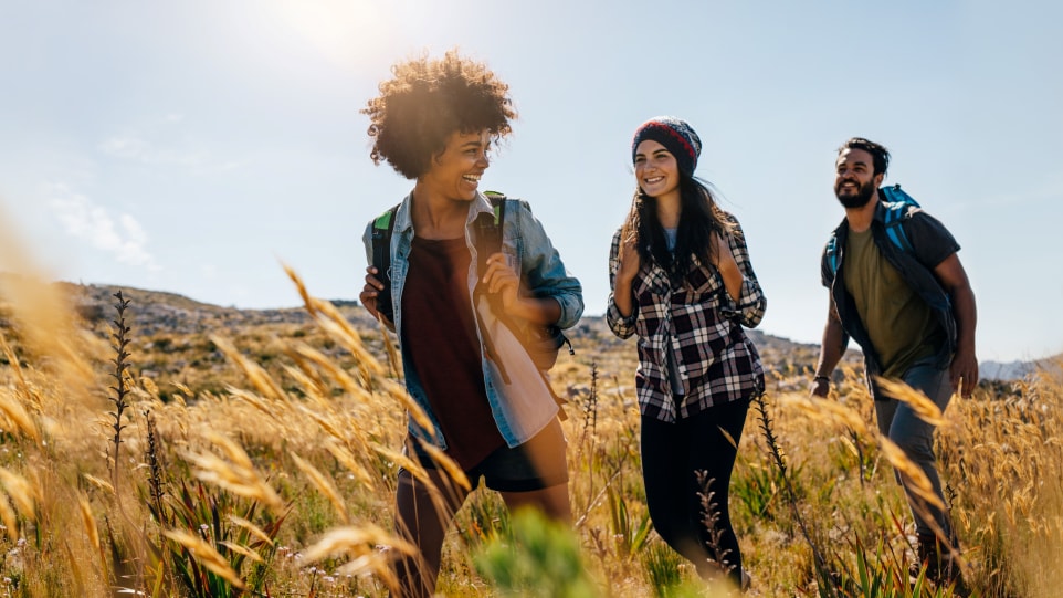 About the Center Young adults walking in a field
