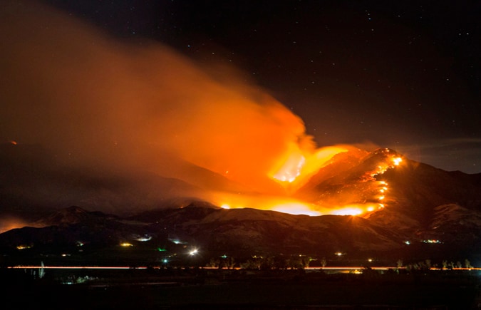 wildfire setting a hill on fire