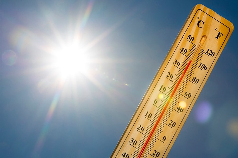 Construction worker wiping sweat in extreme heat