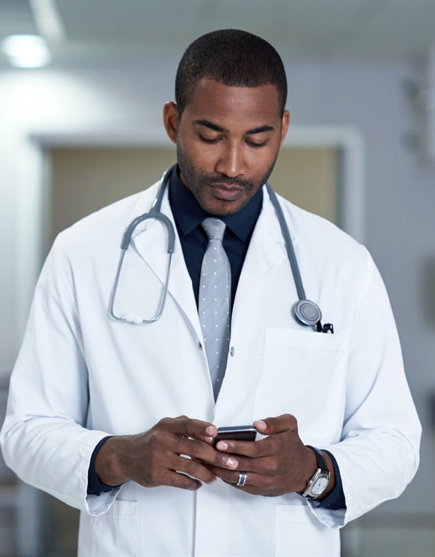 NCEZID Accomplishments 2019 - collaborating to make a difference Caring is his calling as a male doctor holding a phone