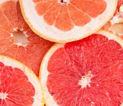 fresh grapefruit and slices fresh grapefruit and slices