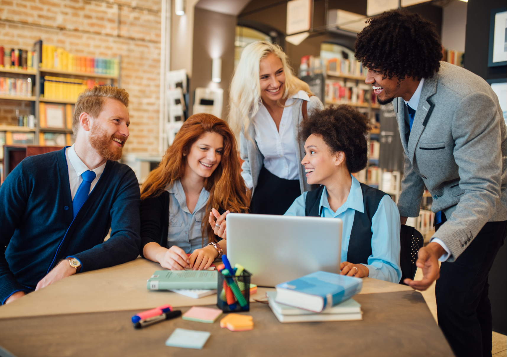 Artboard 2 students and librarians working together