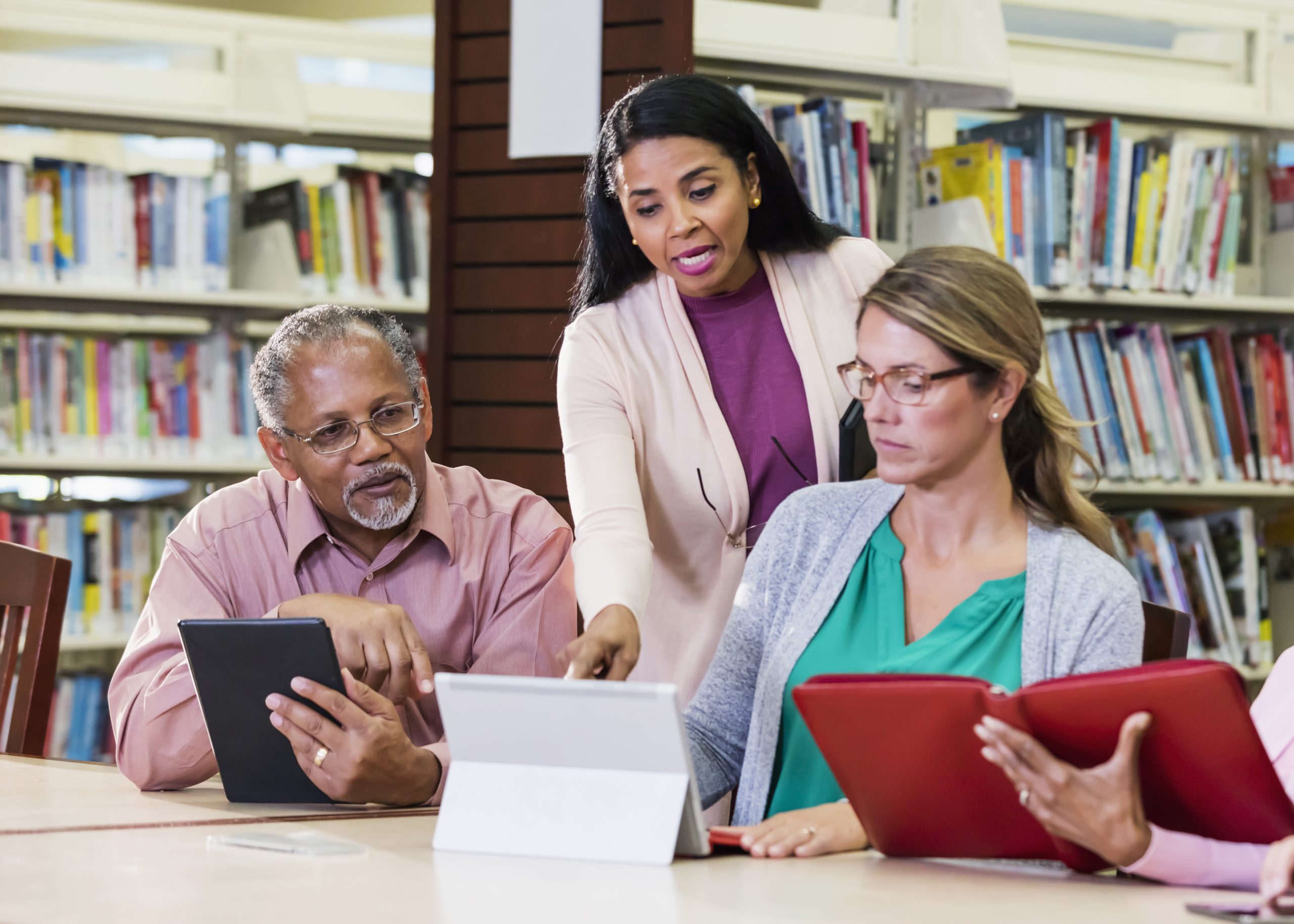 Adult education class, using digital tablets Adult education class, using digital tablets