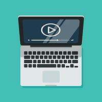 An open laptop displaying a play icon