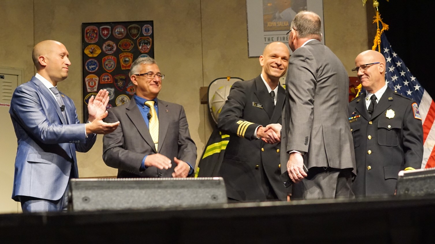 Kenny Fent (NIOSH) shakes hands with David Rhodes (Fire & Rescue) on stage at FDIC after signing up for the NFR. Andrew Pantelis (IAFF), Victor Stagnaro (NFFF), and Joe Schumacher (FCSN) also shared their support for the NFR. Kenny Fent (NIOSH) shakes hands with David Rhodes (Fire & Rescue) on stage at FDIC after signing up for the NFR. Andrew Pantelis (IAFF), Victor Stagnaro (NFFF), and Joe Schumacher (FCSN) also shared their support for the NFR.