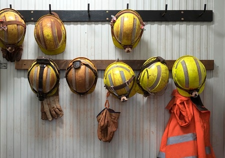 hard hats on a wall