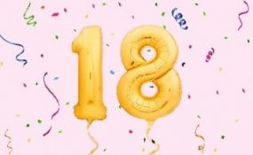 the number 18 with streamers
