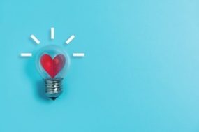 heart-bulb graphic of a heart inside of a light bulb