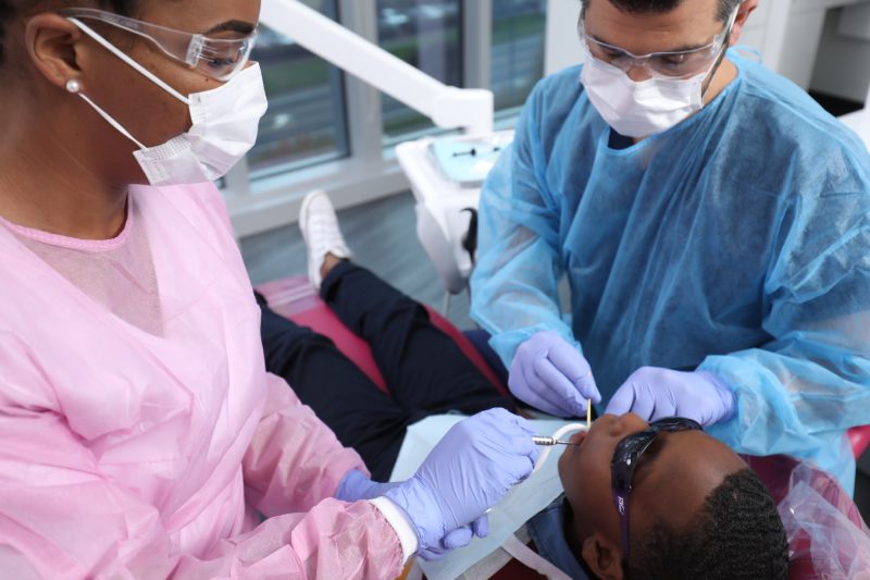 patient-at-dentist-clinic-gets-dental-treatment patient at dentist clinic gets dental treatment