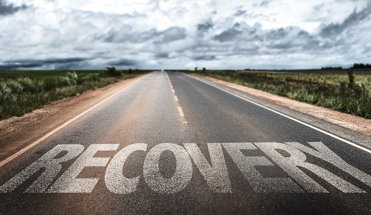 the word recovery written on the street