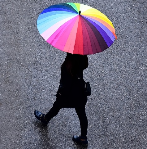 A beautiful girl with a cheerful umbrella