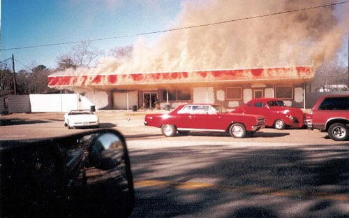 Photo 1. Fire fighters preparing to enter fire building.