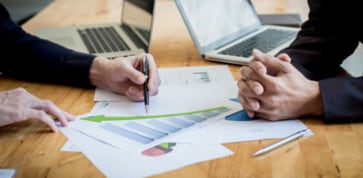 Two co-workers collaborating in a business meeting