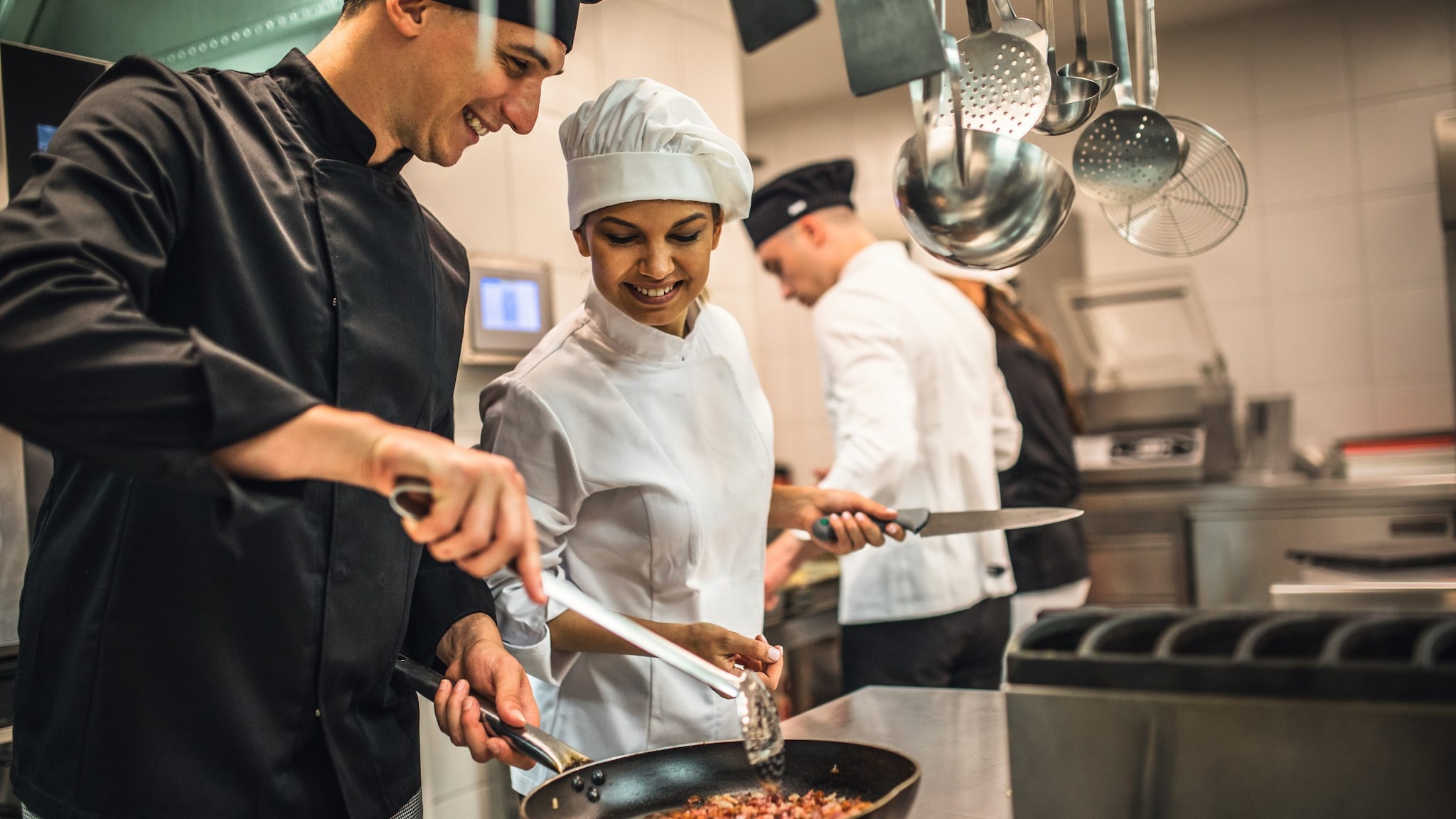 Services Program Banner A team of chefs in a modern kitchen