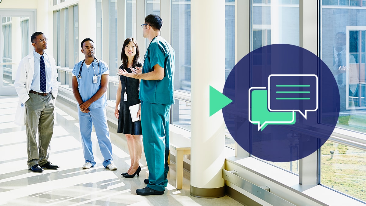 Action 4 Image 1 A varied group of healthcare workers chats in a hallway with an icon of overlapping speech bubbles.