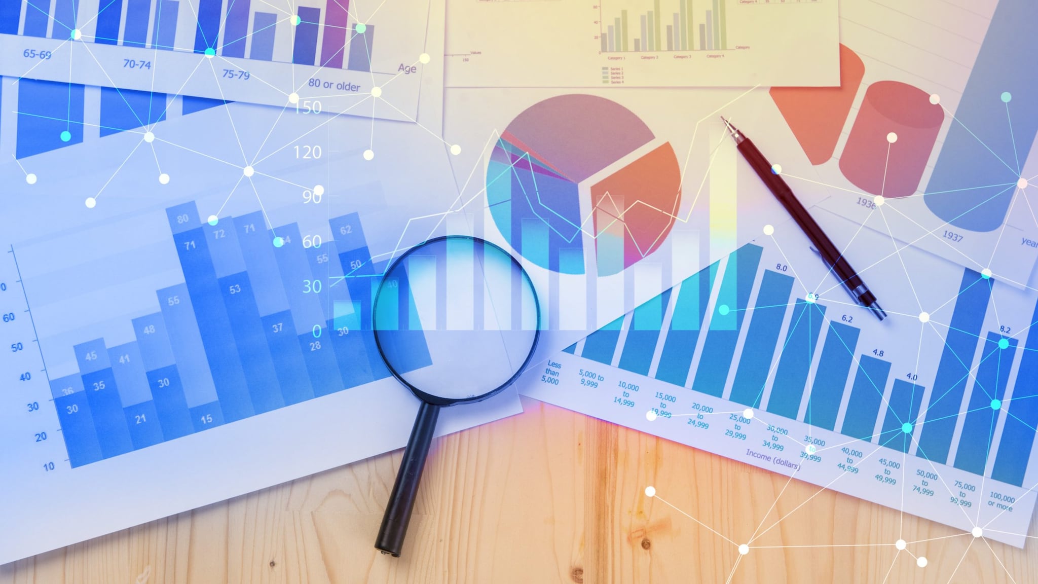 Research and Data Magnifying Glass Magnifying glass over graphs of research data