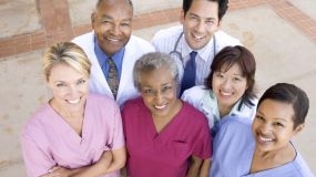 — title missing — Group of healthcare workers smiling for picture.