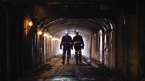 — title missing — Two backlit miners in dark NIOSH Pittsburgh research mine entry 2018
