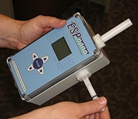 Inserting a “sampling key” into the ESPnano model 100 particle sampler.