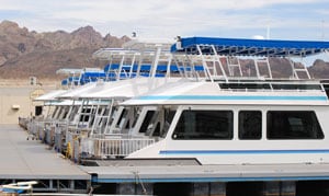 COboating.jpg A photo of a fleet of houseboats tied to a dock.